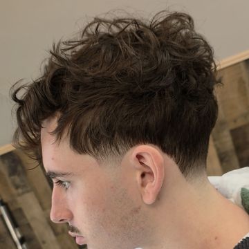 Textured short haircut with a tapered finish